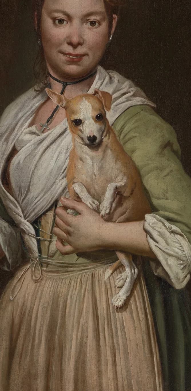 Small dog being held