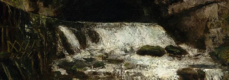 waterfall flowing from cave